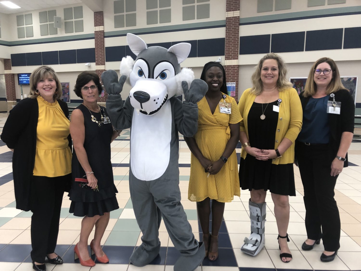 Picture of administrators and counselors with mascot